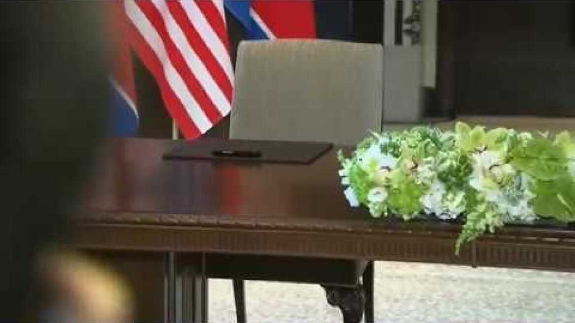 Nkorean Sec Agent sterilizes Kim Jong Un's dedicated pen before treaty sign