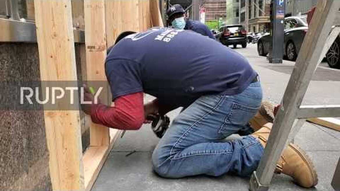 USA: Manhattan stores board up windows after mass looting overnight