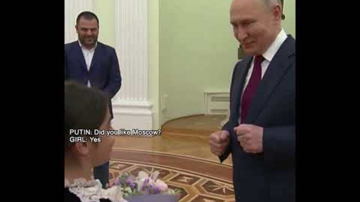 Putin hosts 8-year old girl in Kremlin, hugs her and kisses on the head
