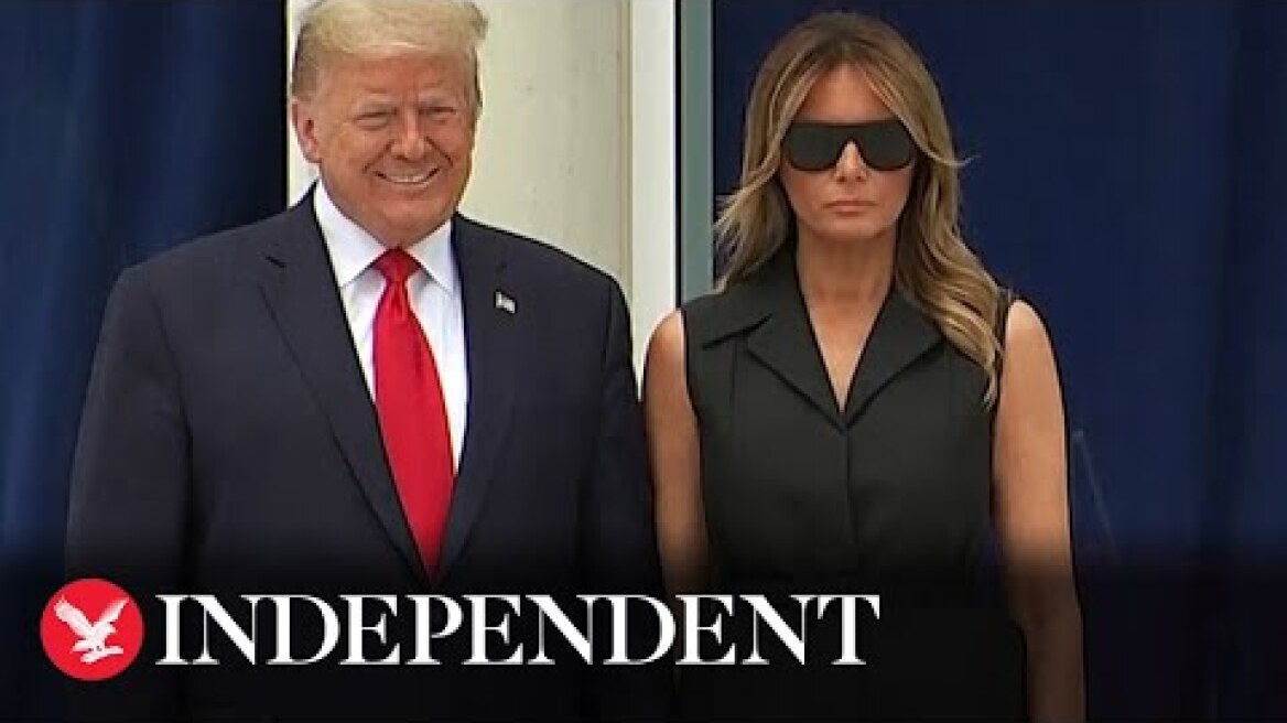 Trump appears to ask Melania to smile during visit to the Saint John Paul II National Shrine