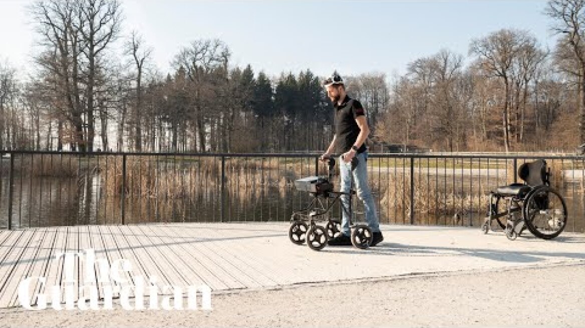 Paralysed man able to stand and walk with an aid after doctors implant device
