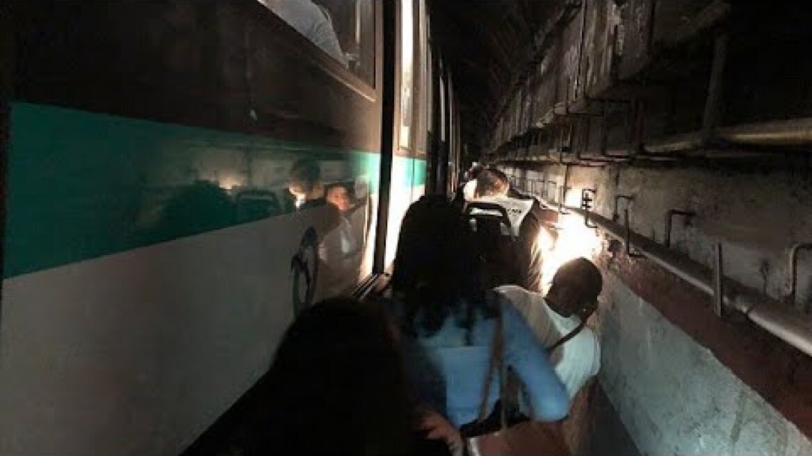 People evacuate Paris Metro after being stuck underground.