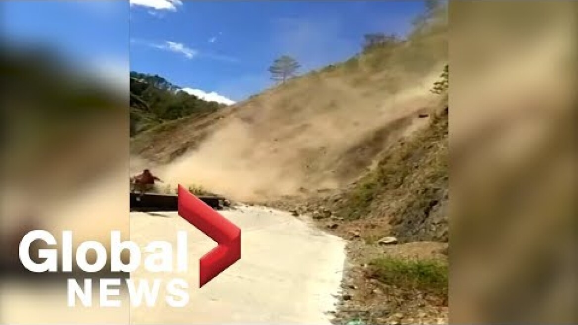 Trapped bus passenger films landslide in Philippines