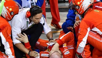 Ferrari mechanic break leg during Bahrain F-1 pit stop! (warning: distressing video)