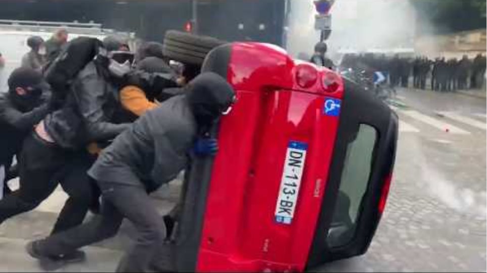 Protesters Flip car over and use as baracade!!!