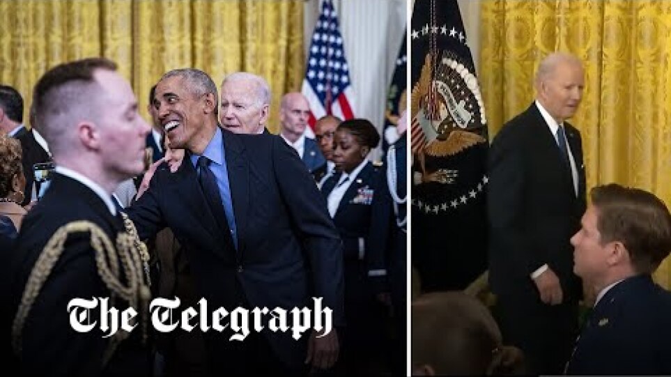 Biden appears 'lost' in White House event as guests swarm around Barack Obama instead