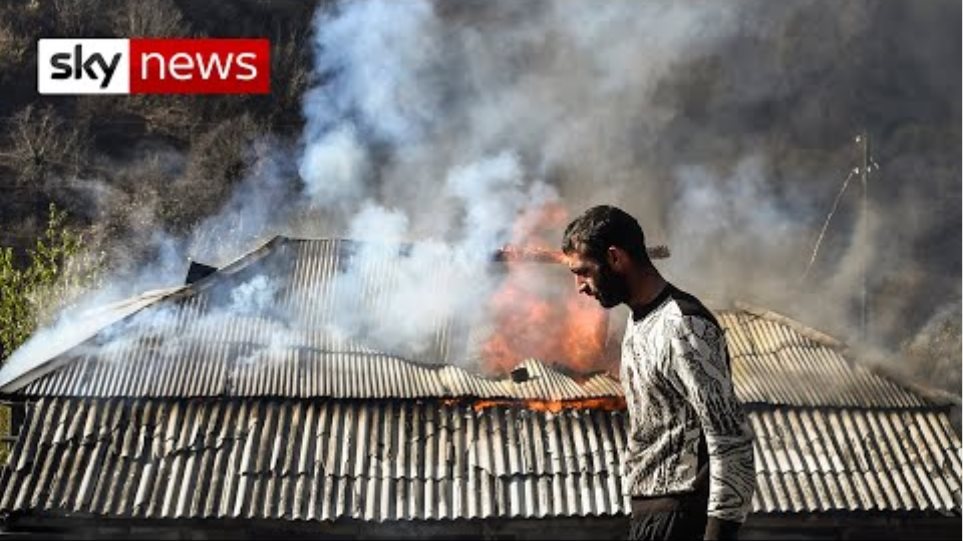 Nagorno-Karabakh: Armenian homes burned down in defiance