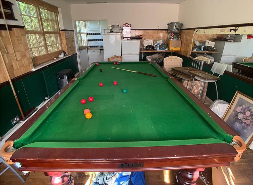 28531650-8331367-One_of_the_rooms_has_a_huge_snooker_table_left_abandoned_with_th-a-51_1589810556853