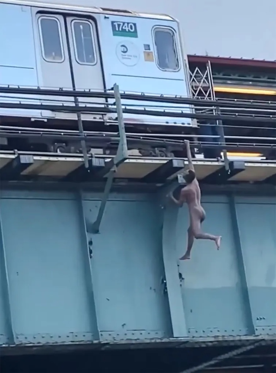 naked-man-dangles-from-train-platform-03